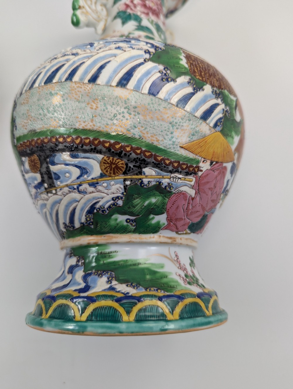 A 19th-century Japanese Kyoto Satsuma porcelain vase featuring scroll handles, a flared rim, and detailed polychrome enamel depictions of human figures and peony blossoms. View XI