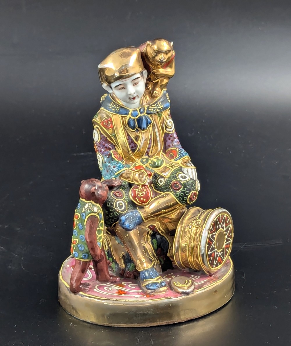 Antique Porcelain Figurine ‘Boy with Monkeys’ by Satsuma, Japan, Meiji period (1868 -1912).