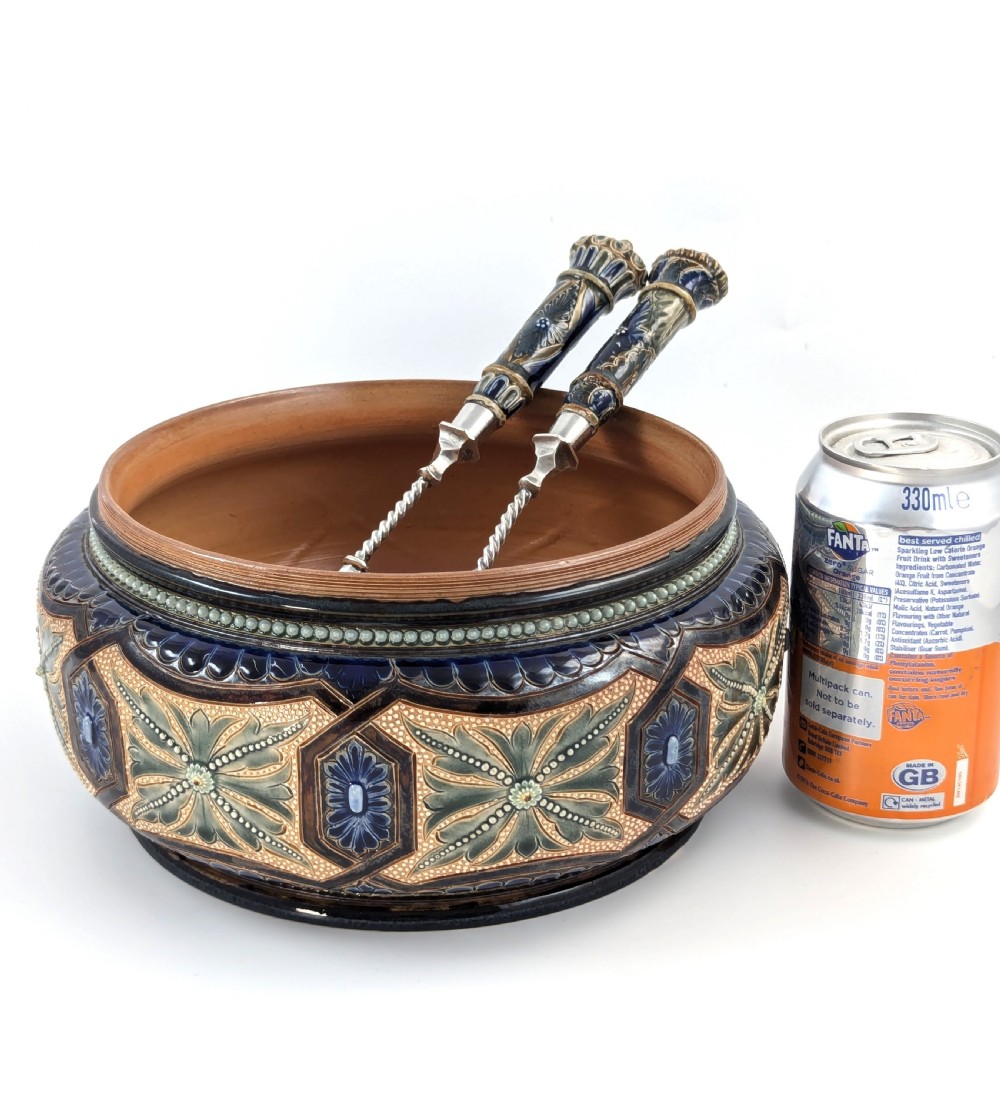 A Victorian Doulton Lambeth stoneware salad bowl decorated with cobalt blue and terracotta geometric patterns, presented with two matching ceramic-handled silver servers. View VIII