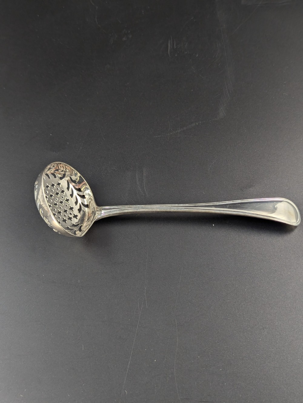 A George III Sterling Silver Sugar Sifter Spoon, Mark of John Lambe, London, circa 1789 View II