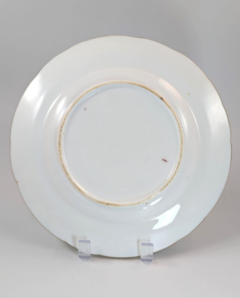 A pair of Victorian Minton porcelain cabinet plates featuring turquoise rims with gilt details, floral cartouches, and a central painted coat of arms. View IX