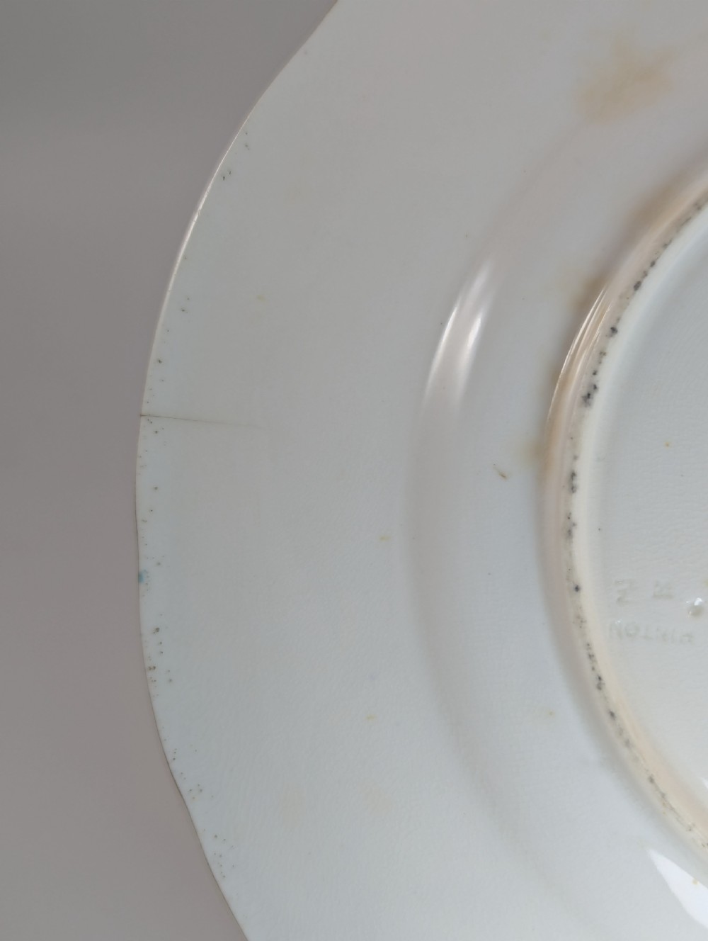 A circular Victorian porcelain cabinet plate featuring a hand-painted landscape scene encircled by a turquoise border with gilded tooling. View V
