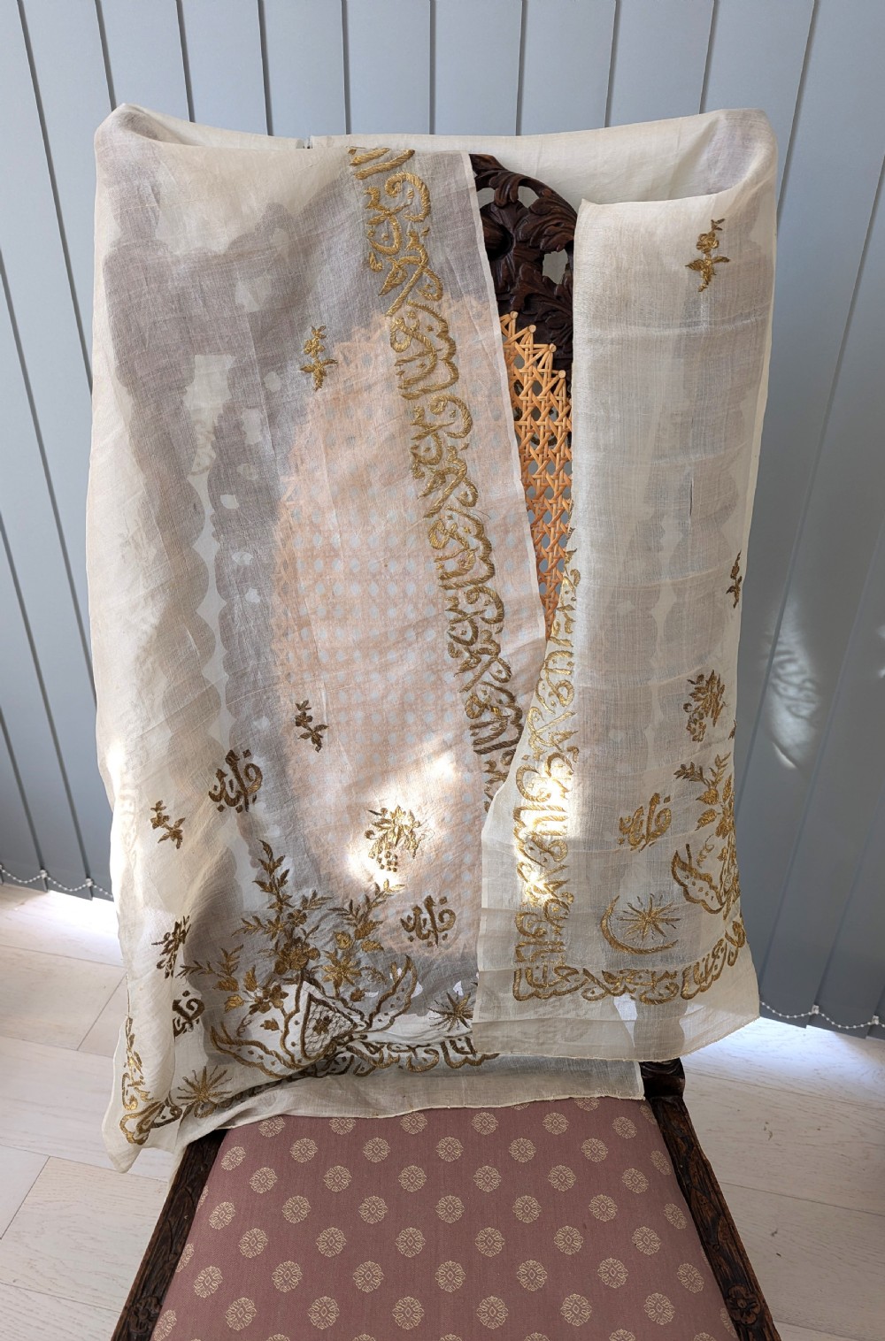 A light cream silk scarf featuring metallic gold thread hand embroidery with floral motifs, crescent symbols, and calligraphic borders. View III