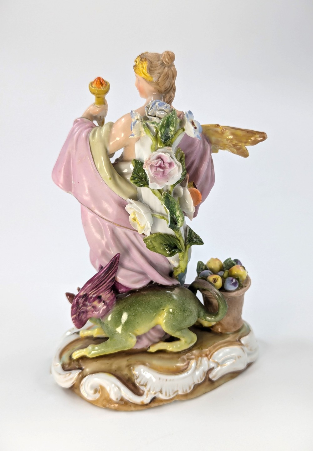 Late 19th-century German Volkstedt porcelain allegorical figurine depicting a draped female figure holding a torch and sheaf of wheat atop a gilded scroll base. View III