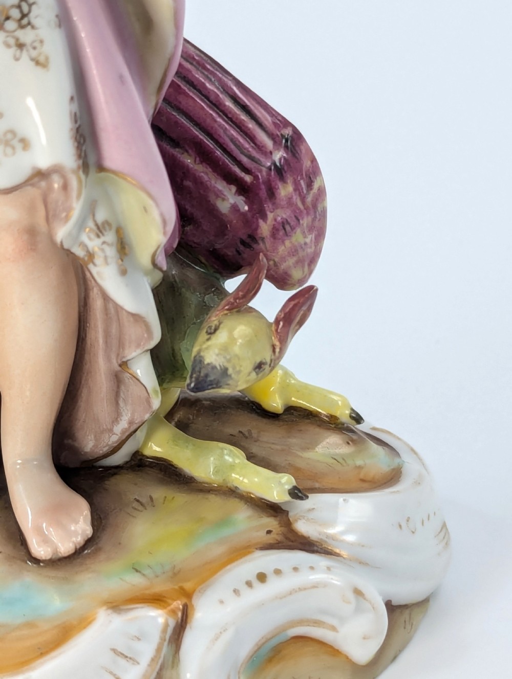 Late 19th-century German Volkstedt porcelain allegorical figurine depicting a draped female figure holding a torch and sheaf of wheat atop a gilded scroll base. View VII