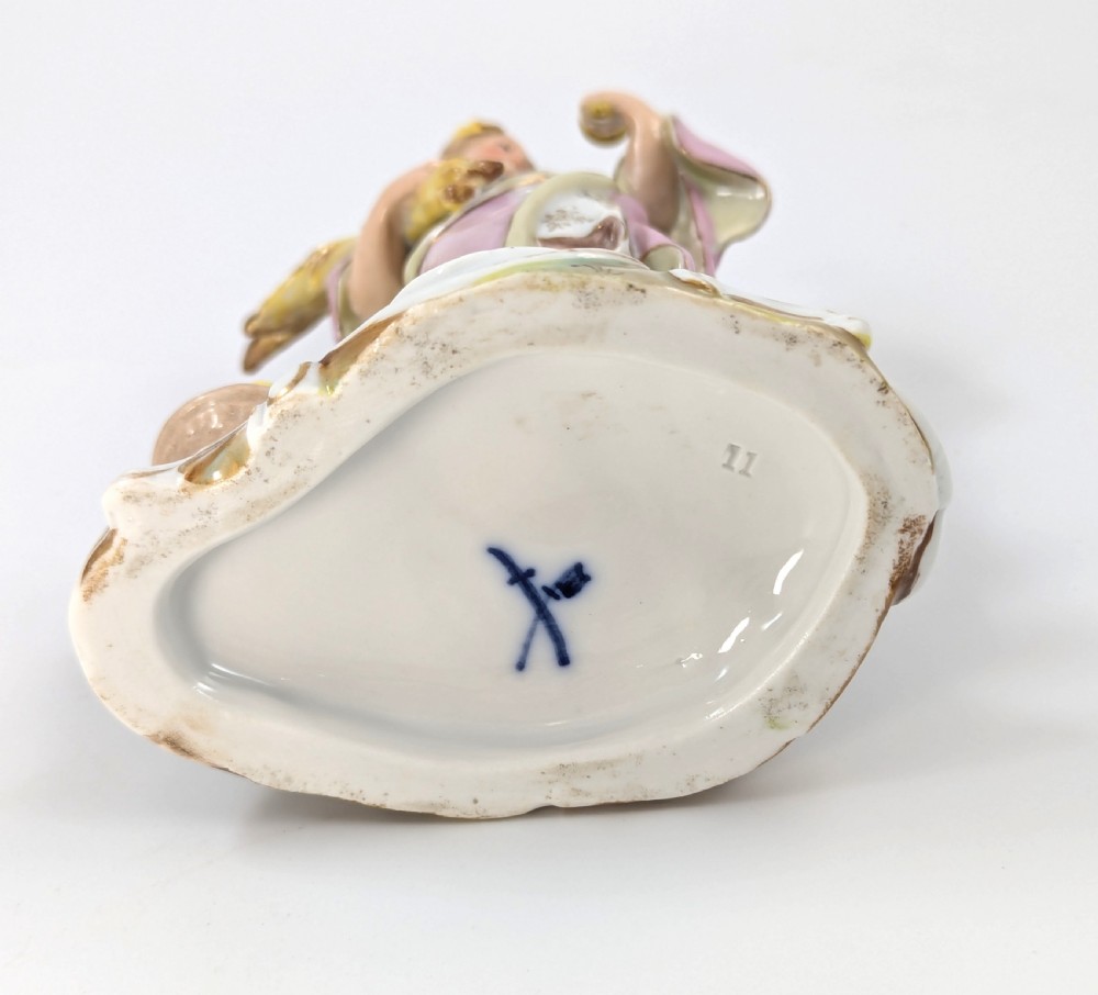 Late 19th-century German Volkstedt porcelain allegorical figurine depicting a draped female figure holding a torch and sheaf of wheat atop a gilded scroll base. View IX