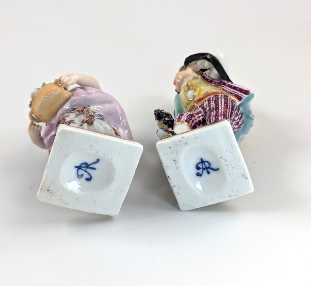 Pair of late 19th-century Helena Wolfsohn porcelain child figurines featuring hand-painted floral attire, baskets, and gilded bases. View VII
