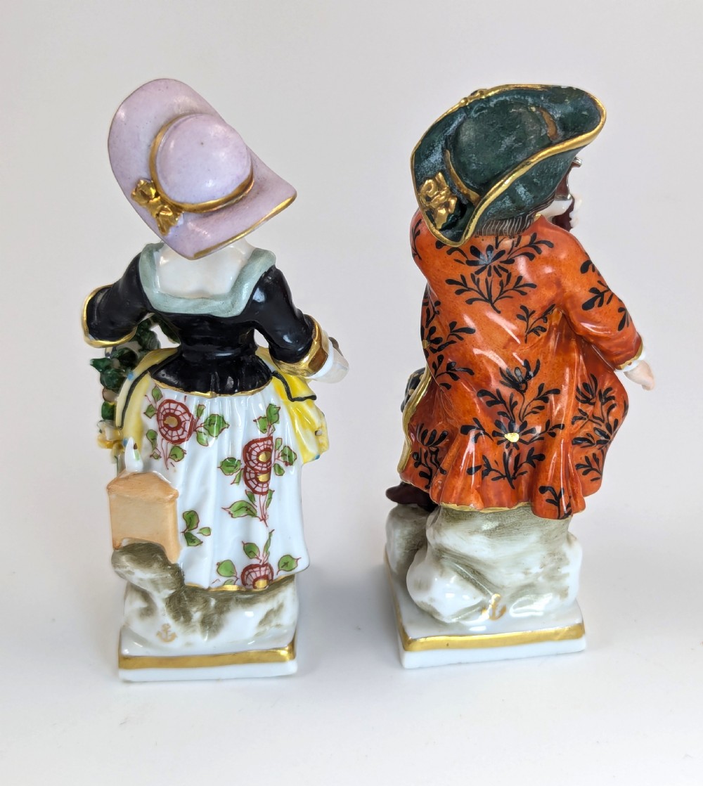 A pair of early 19th-century Chelsea-style hand-painted porcelain figurines depicting a female gardener and a male farmer with gilded accents. View III