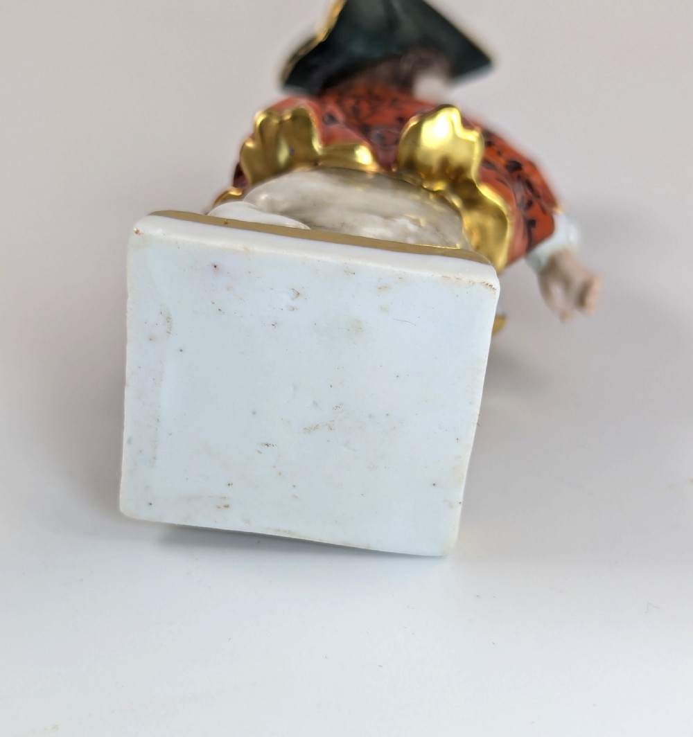 A pair of early 19th-century Chelsea-style hand-painted porcelain figurines depicting a female gardener and a male farmer with gilded accents. View VII