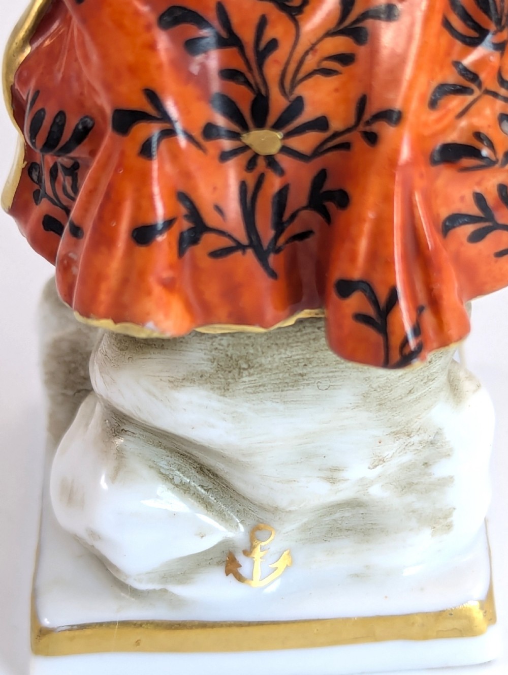 A pair of early 19th-century Chelsea-style hand-painted porcelain figurines depicting a female gardener and a male farmer with gilded accents. View VIII