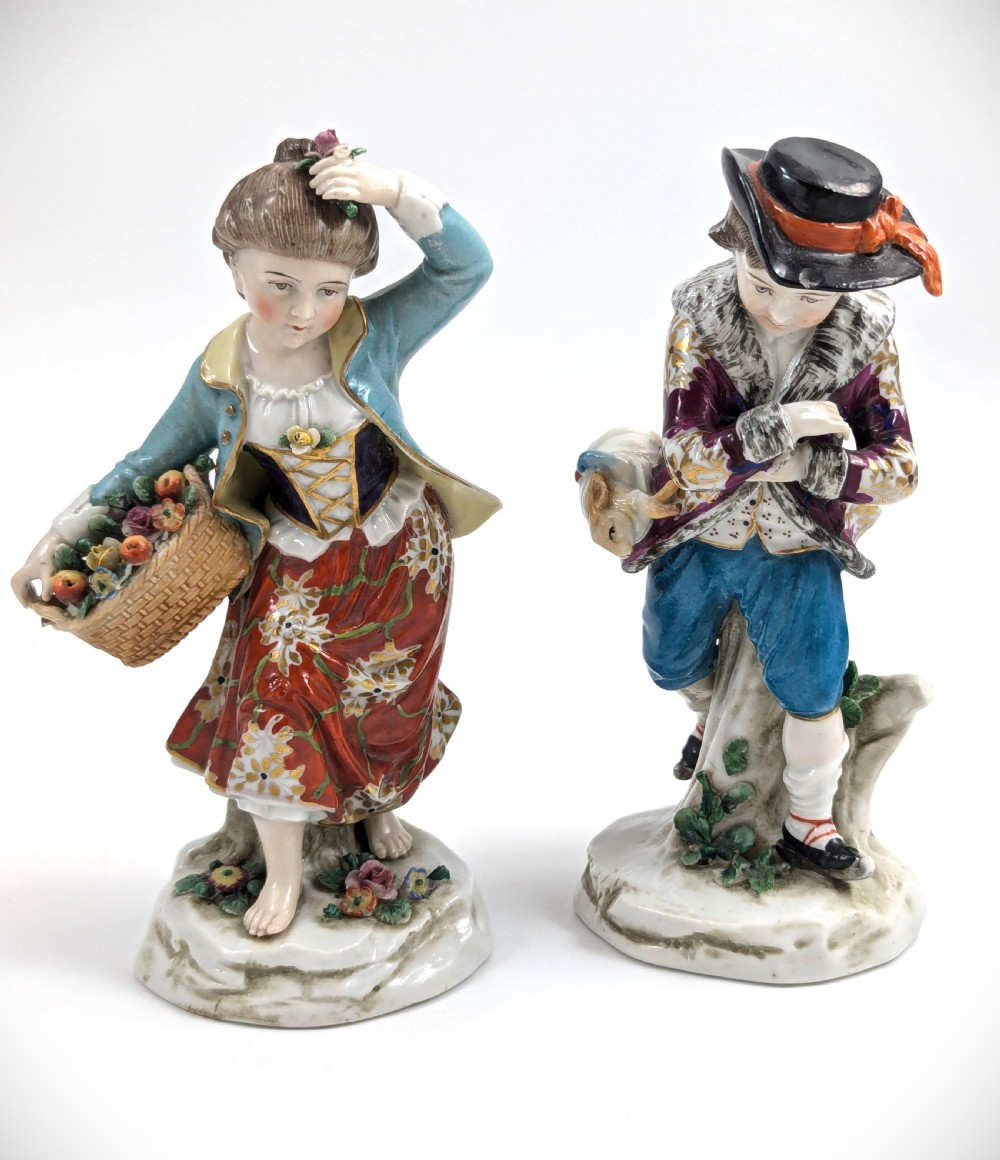 A pair of 19th-century Samson polychrome porcelain figurines depicting allegorical seasonal figures on naturalistic bases.