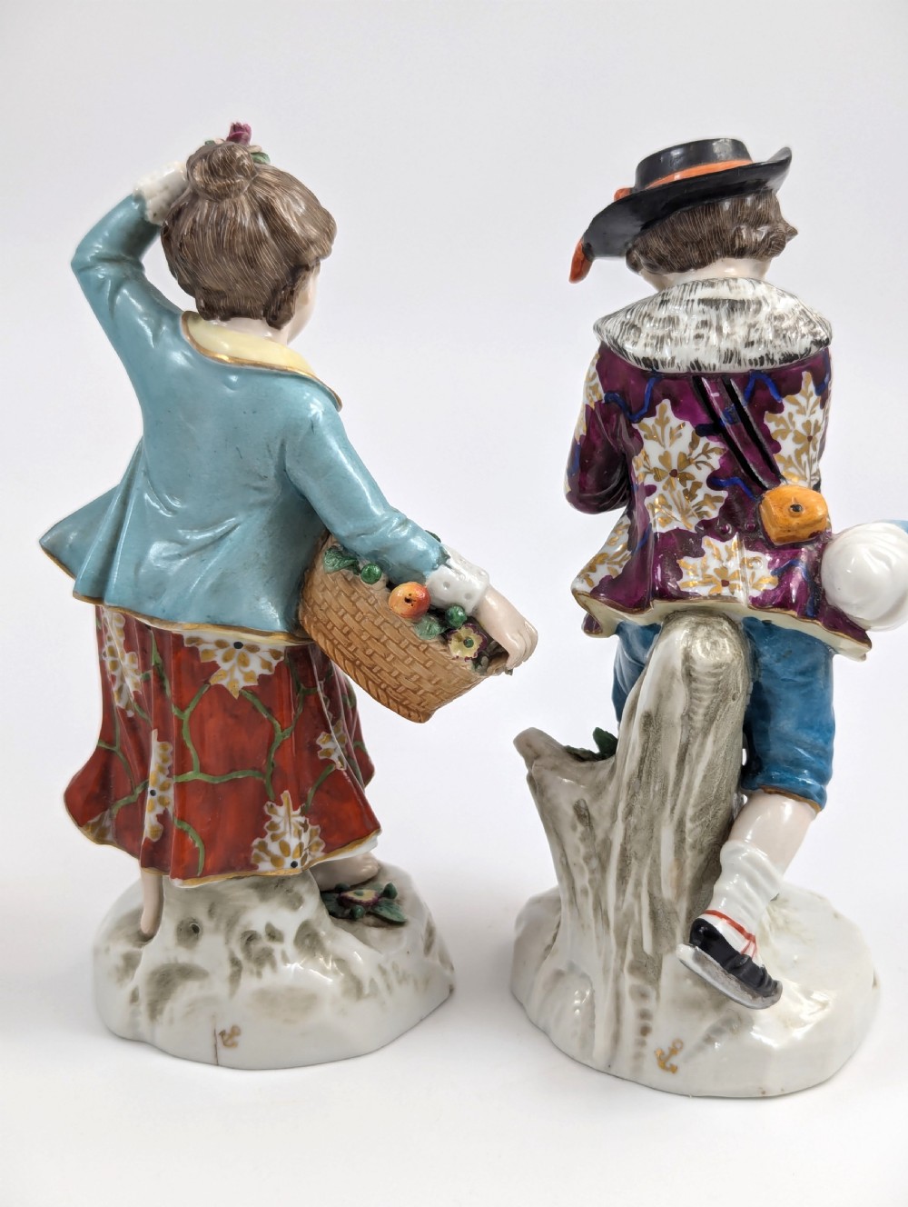 A pair of 19th-century Samson polychrome porcelain figurines depicting allegorical seasonal figures on naturalistic bases. View IV