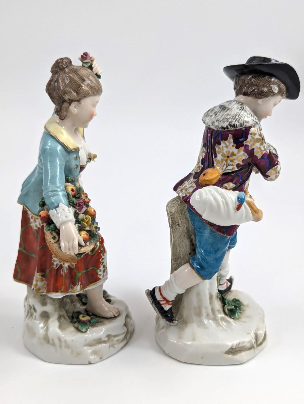 A pair of 19th-century Samson polychrome porcelain figurines depicting allegorical seasonal figures on naturalistic bases. View V