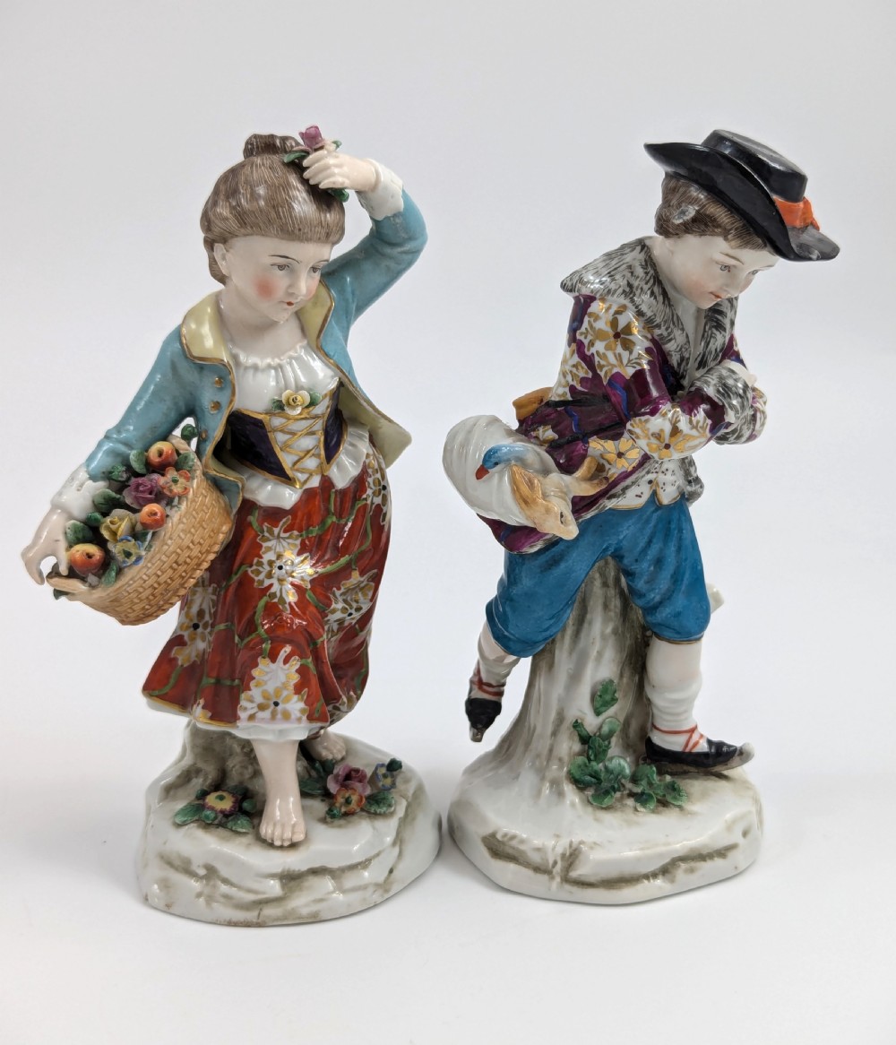 A pair of 19th-century Samson polychrome porcelain figurines depicting allegorical seasonal figures on naturalistic bases. View VI