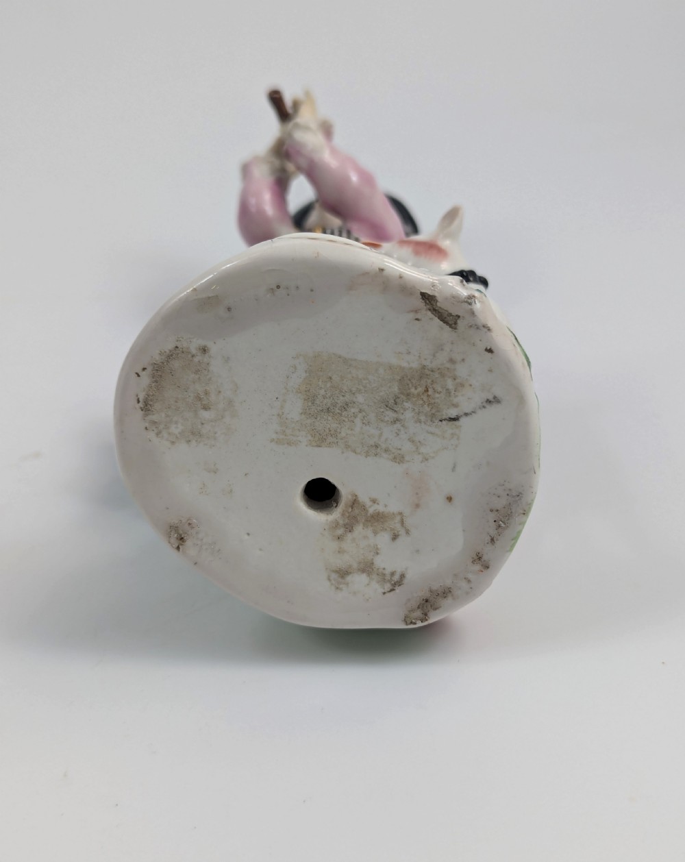 An 18th-century Derby soft-paste porcelain figurine depicting a shepherd playing a pipe with a dog standing beside him on a gilded scroll base. View VIII