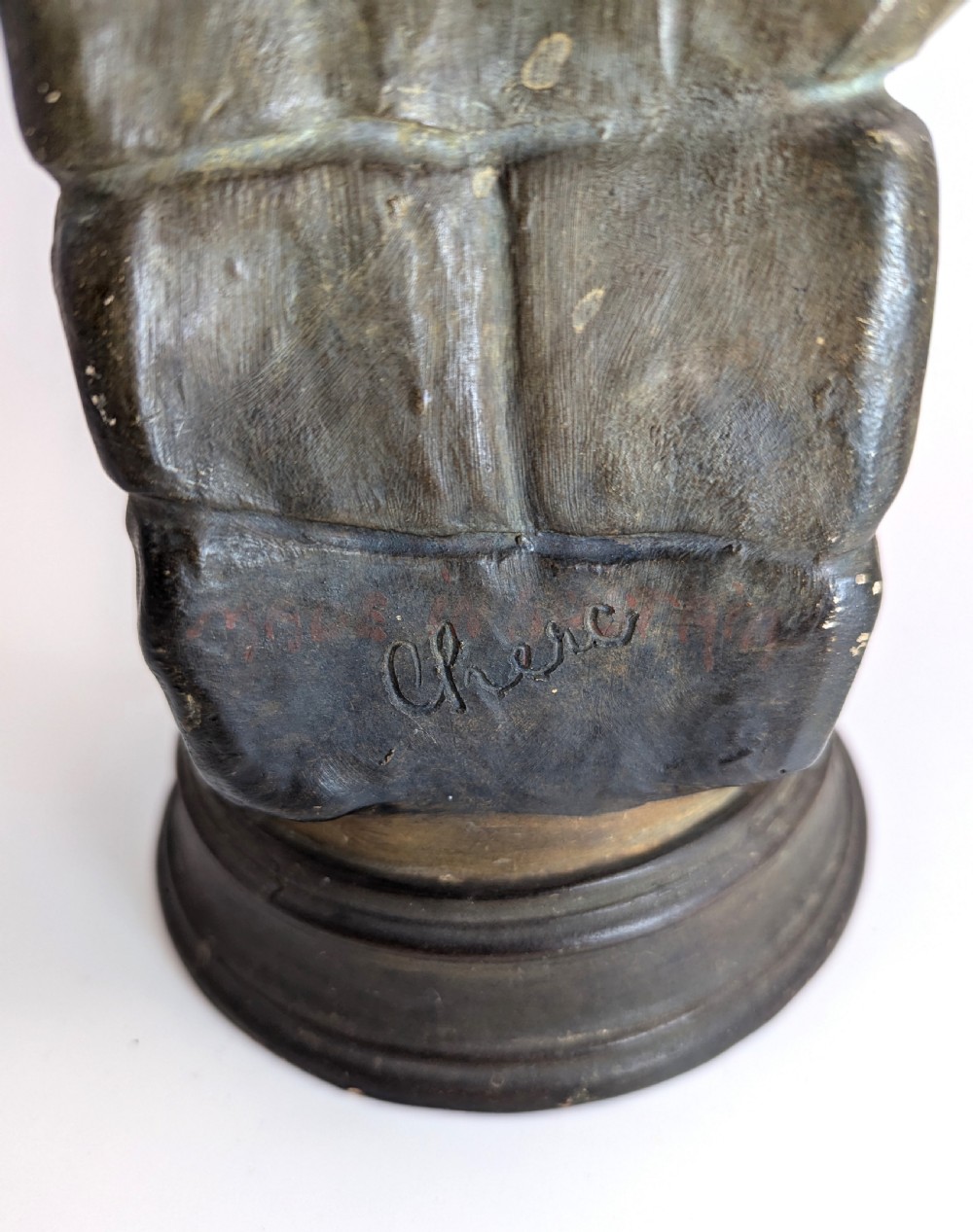 An Art Nouveau earthenware figurine depicting a draped female figure resting against a water pitcher on a stone-effect pillar. View VII