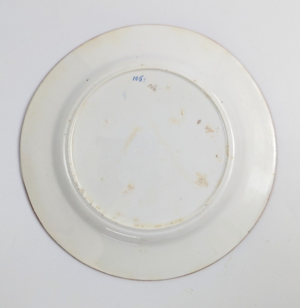 An early nineteenth-century Minton porcelain trio comprising a coffee can, saucer, and plate decorated with hand-painted terracotta, blue, and green floral and animal motifs. View IV