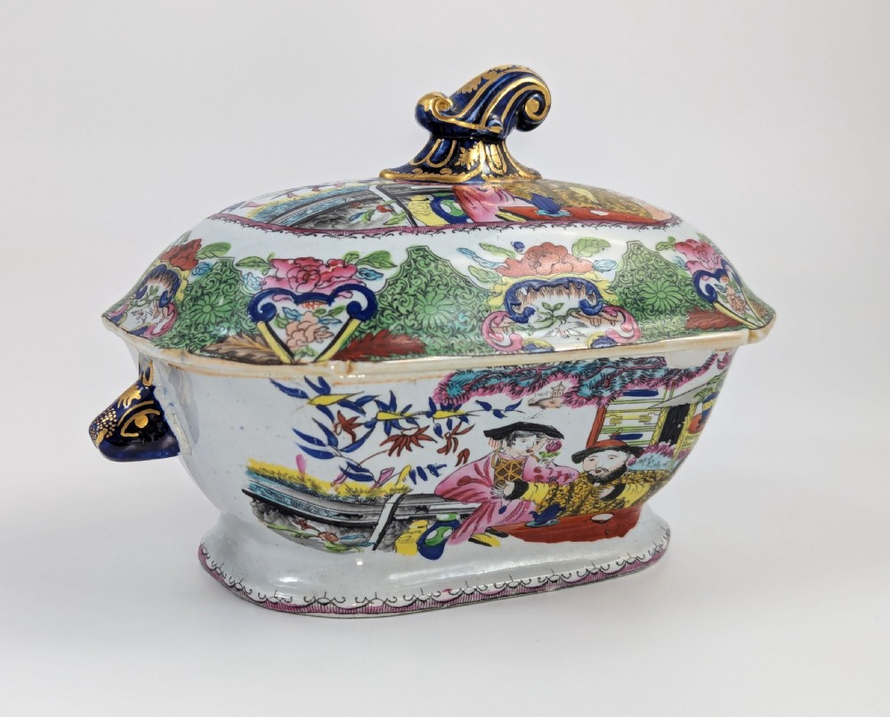 A Regency Masons ironstone tureen decorated in the Green Mandarin chinoiserie pattern with cobalt blue handles and a gilded scrolling finial. View IV
