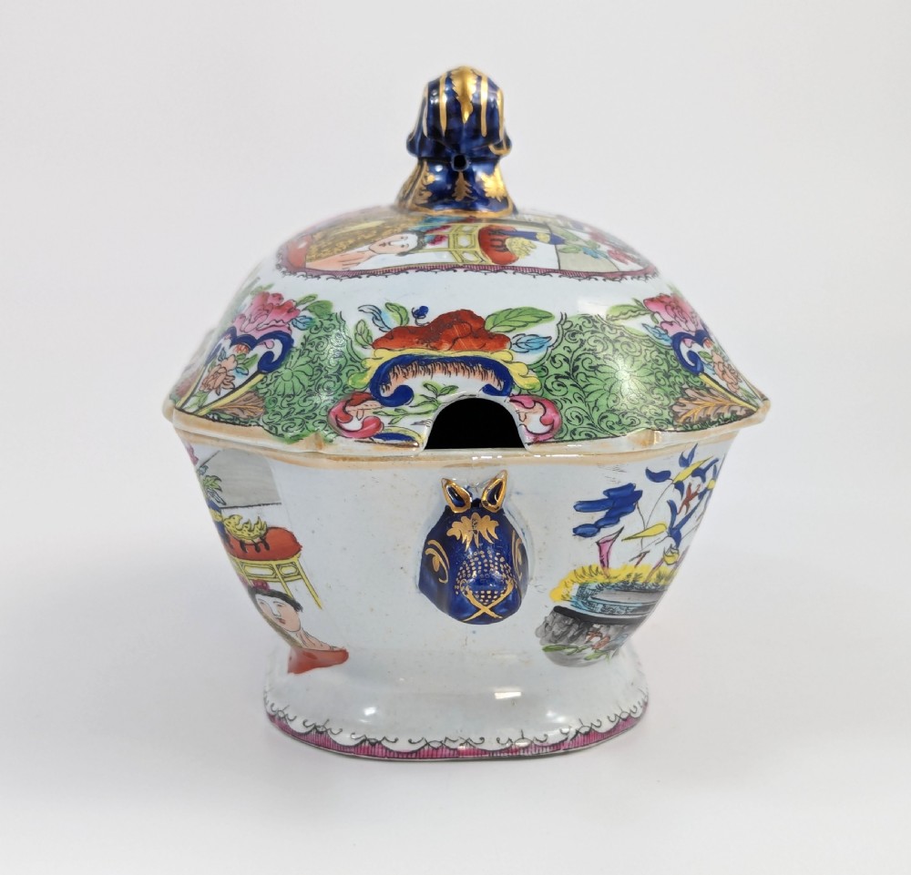A Regency Masons ironstone tureen decorated in the Green Mandarin chinoiserie pattern with cobalt blue handles and a gilded scrolling finial. View VII