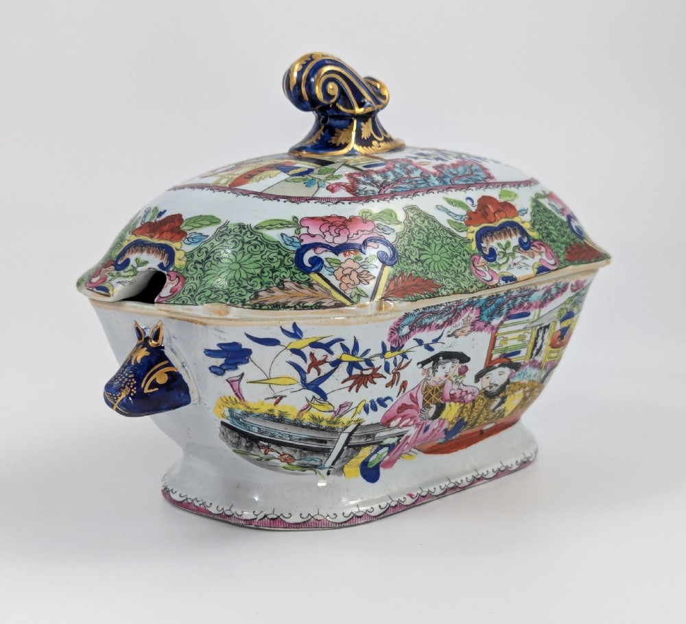 A Regency Masons ironstone tureen decorated in the Green Mandarin chinoiserie pattern with cobalt blue handles and a gilded scrolling finial. View VIII