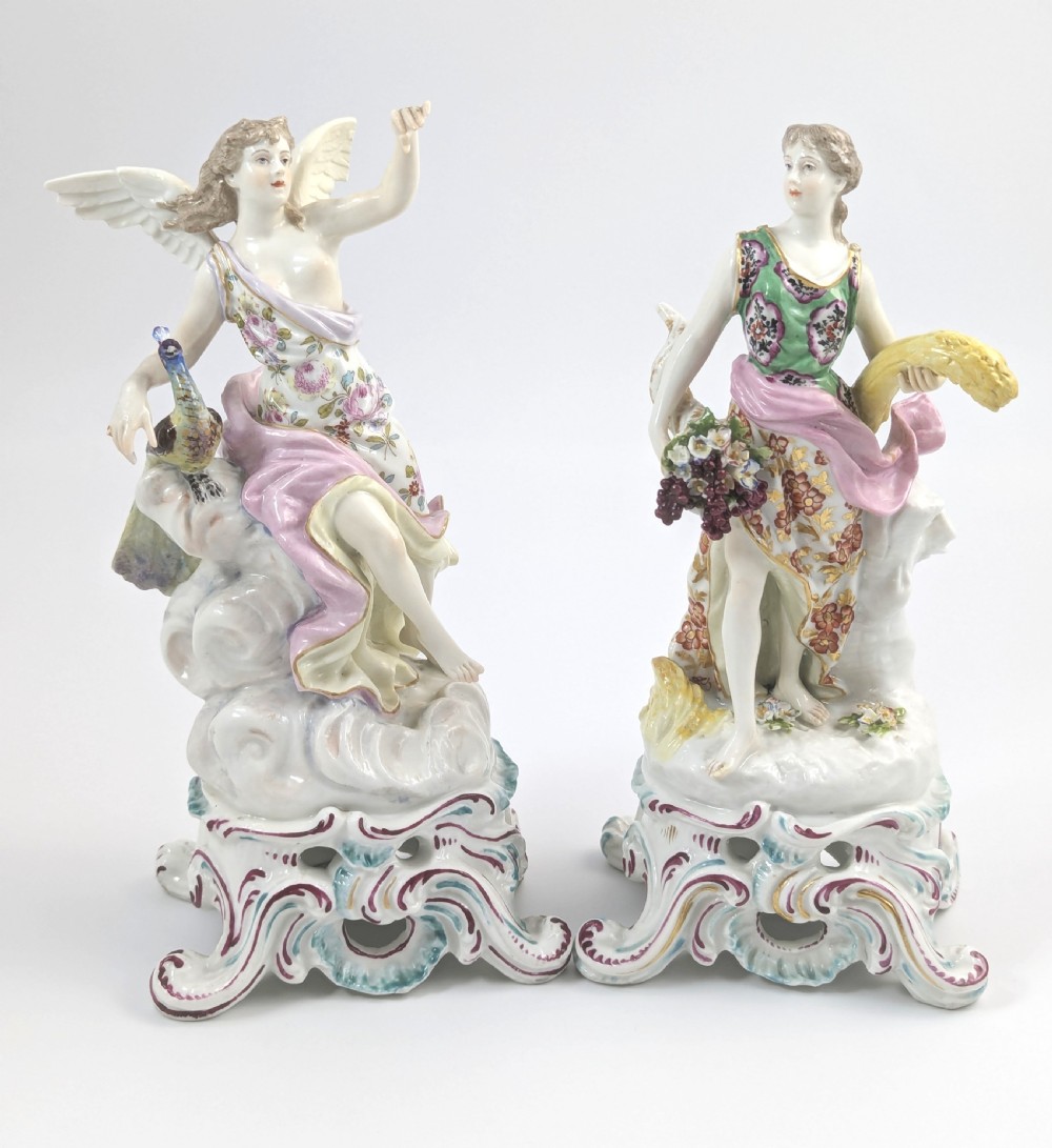A pair of 19th-century French Samson polychrome porcelain allegorical figures standing on pierced Rococo scroll pedestals.