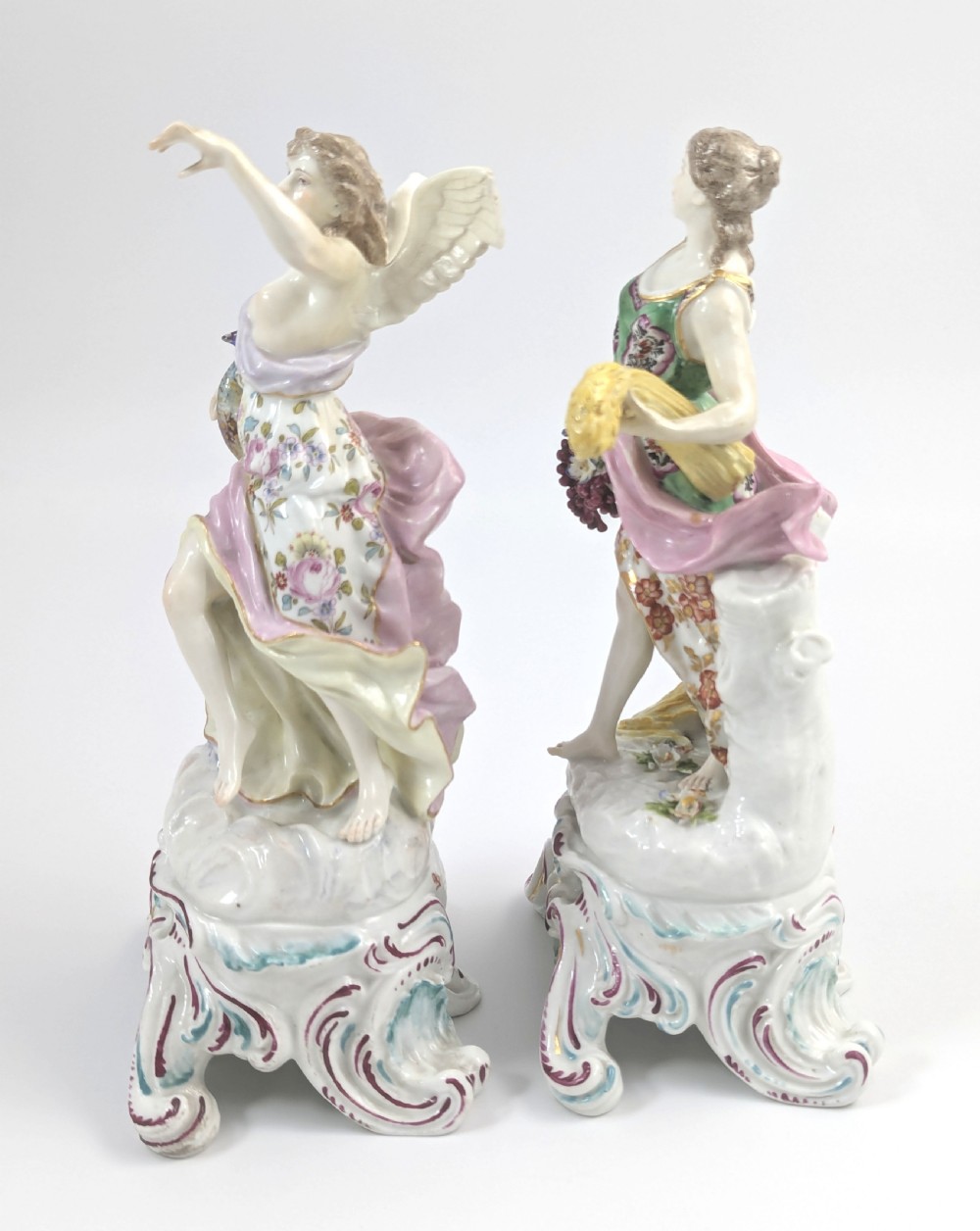 A pair of 19th-century French Samson polychrome porcelain allegorical figures standing on pierced Rococo scroll pedestals. View II
