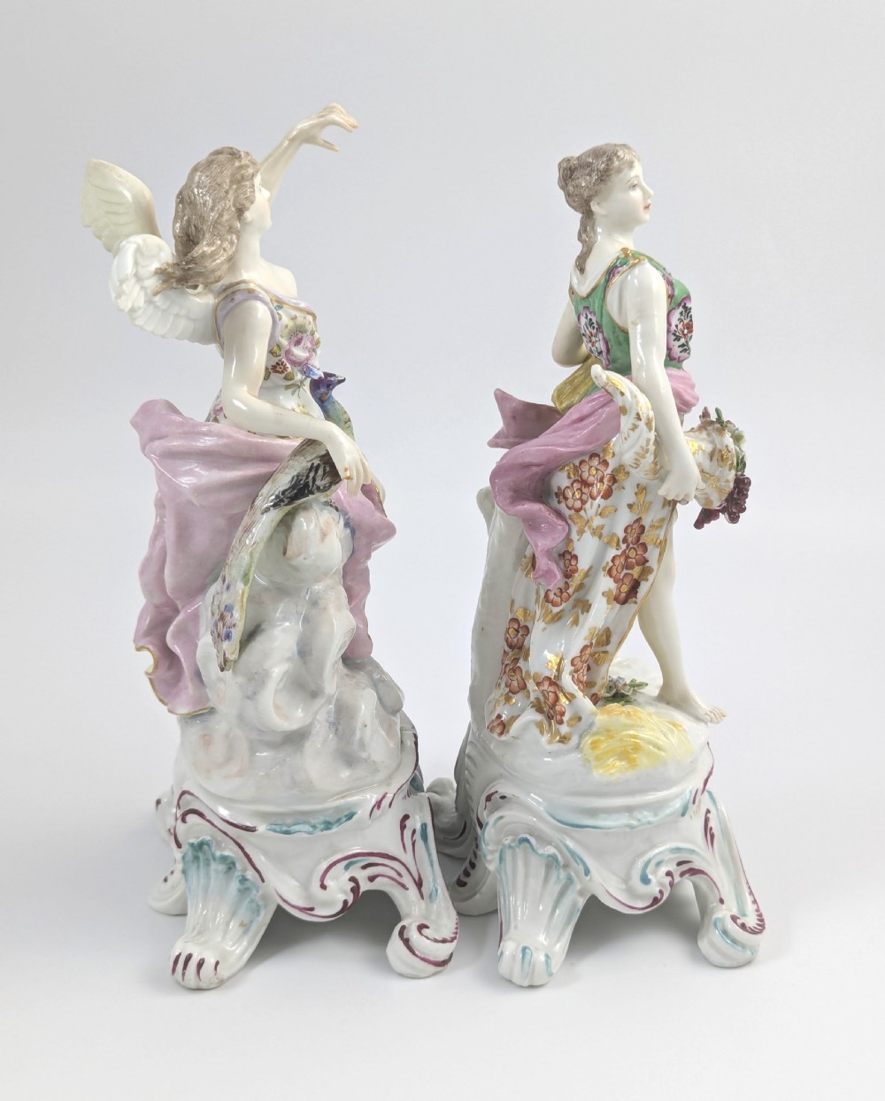 A pair of 19th-century French Samson polychrome porcelain allegorical figures standing on pierced Rococo scroll pedestals. View IV