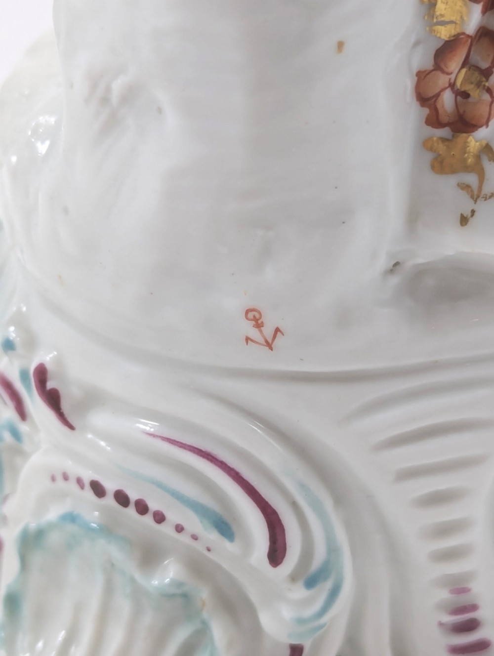 A pair of 19th-century French Samson polychrome porcelain allegorical figures standing on pierced Rococo scroll pedestals. View V