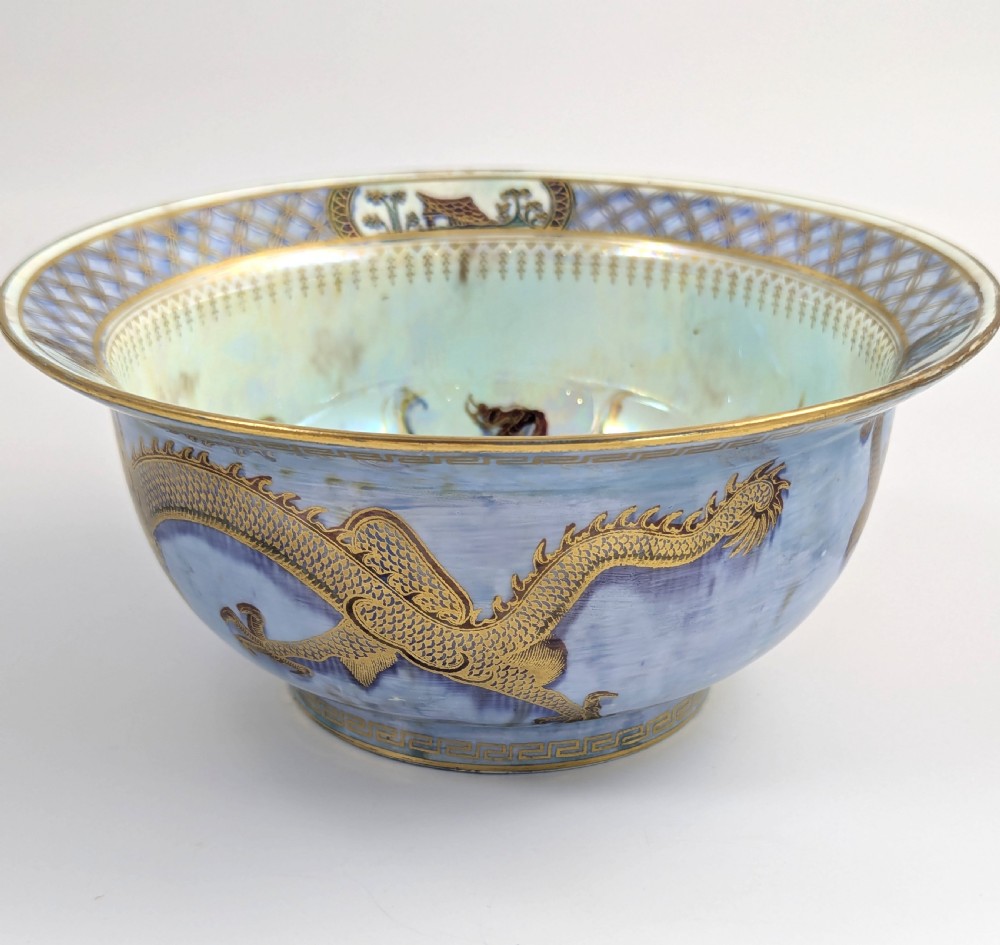 An antique light blue lustre porcelain bowl decorated with a detailed gilded dragon motif around the exterior. View II