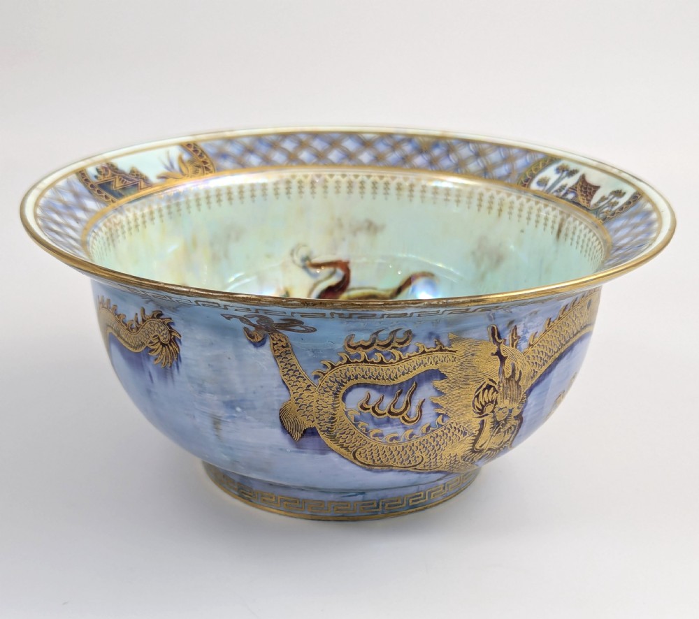 An antique light blue lustre porcelain bowl decorated with a detailed gilded dragon motif around the exterior. View III