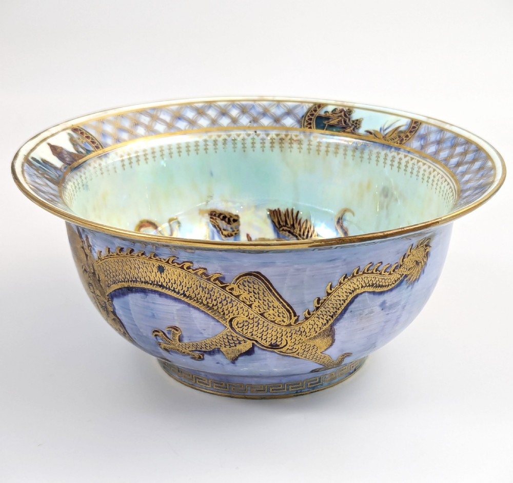 An antique light blue lustre porcelain bowl decorated with a detailed gilded dragon motif around the exterior. View V