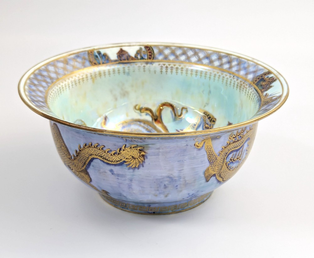 An antique light blue lustre porcelain bowl decorated with a detailed gilded dragon motif around the exterior. View VI