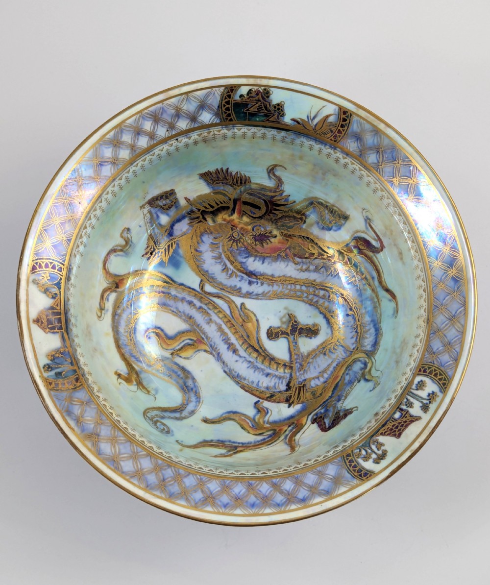 An antique light blue lustre porcelain bowl decorated with a detailed gilded dragon motif around the exterior. View VII