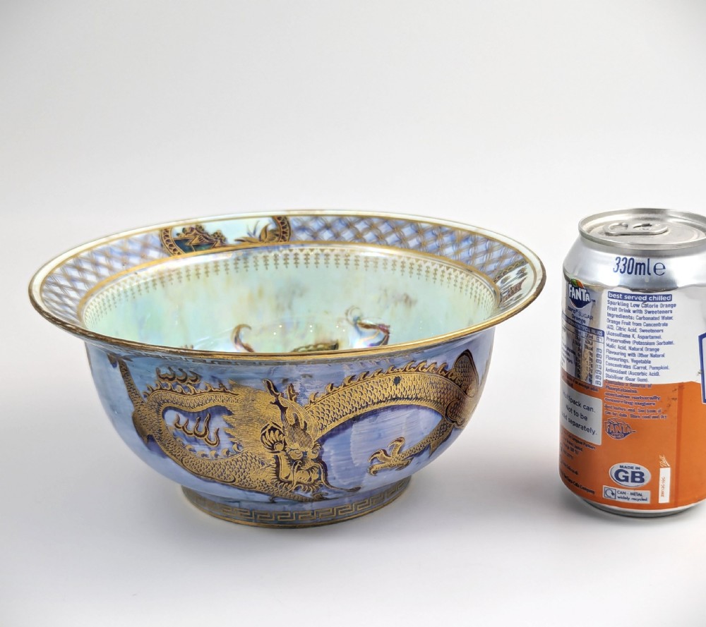 An antique light blue lustre porcelain bowl decorated with a detailed gilded dragon motif around the exterior. View XI