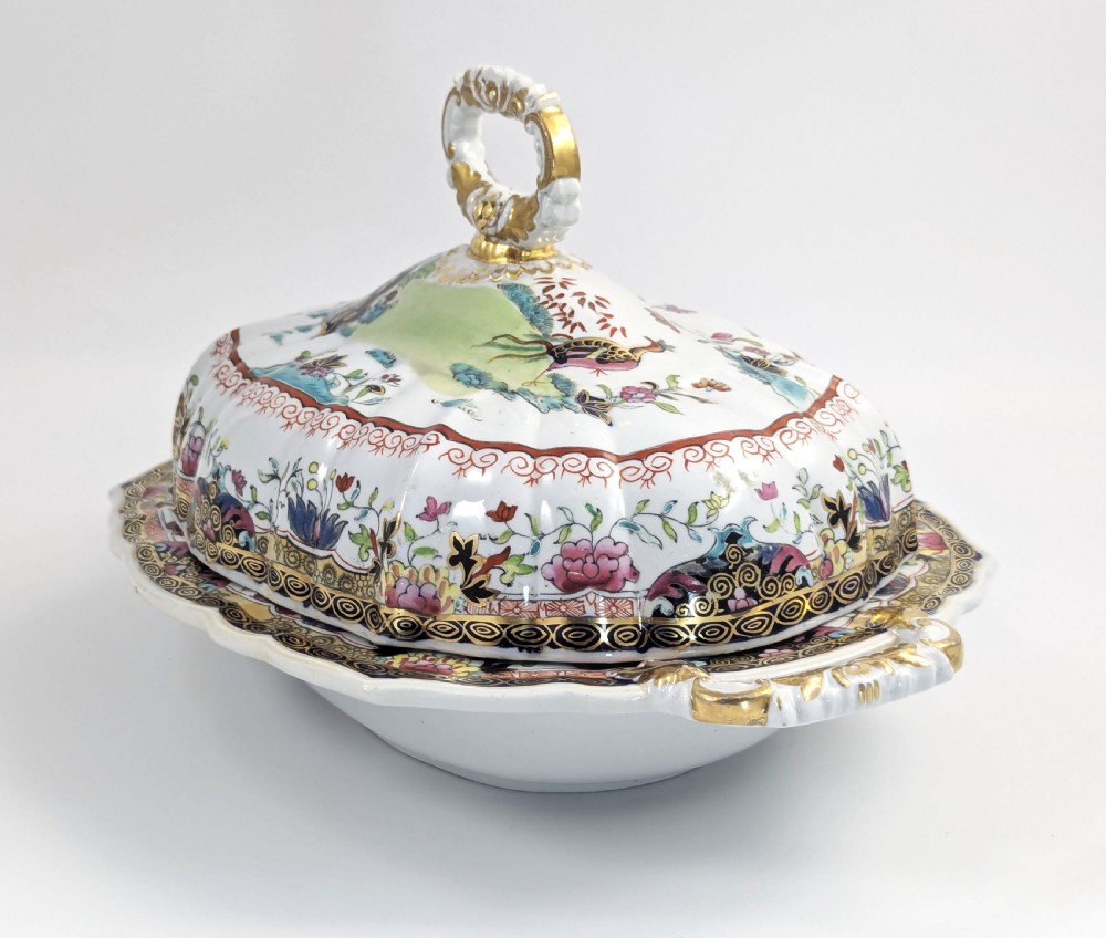 An antique Masons ironstone covered tureen with hand-painted polychrome Chinoiserie floral patterns, loop side handles, and a gilded handle on the lid. View II