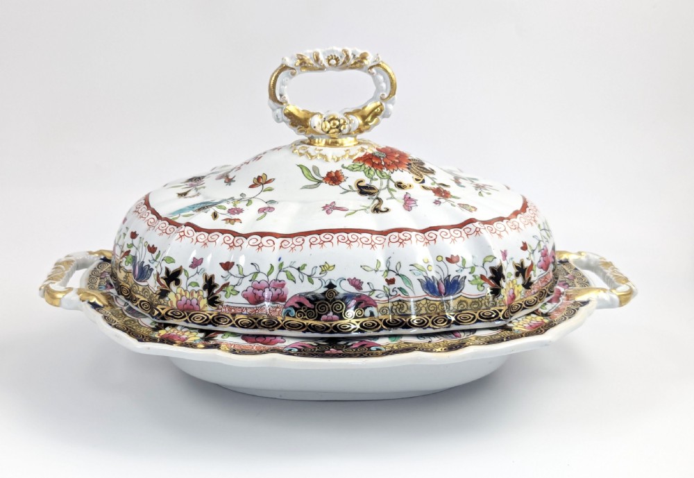 An antique Masons ironstone covered tureen with hand-painted polychrome Chinoiserie floral patterns, loop side handles, and a gilded handle on the lid. View IV