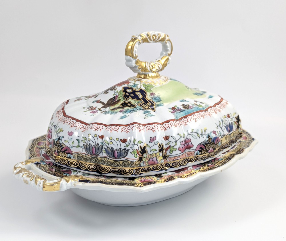 An antique Masons ironstone covered tureen with hand-painted polychrome Chinoiserie floral patterns, loop side handles, and a gilded handle on the lid. View VI
