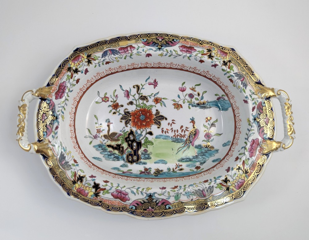 An antique Masons ironstone covered tureen with hand-painted polychrome Chinoiserie floral patterns, loop side handles, and a gilded handle on the lid. View IX