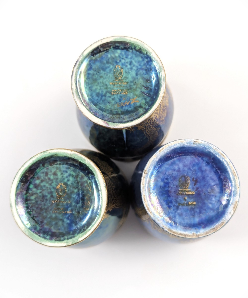 A trio of small blue iridescent ceramic bud vases featuring gilded dragon motifs and flared upper rims. View VII