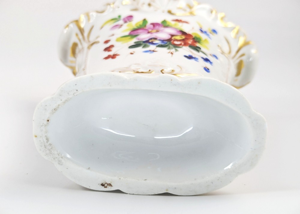 A white hard-paste porcelain vase featuring a flared scalloped rim, hand-painted floral display, and gilded Rococo scroll accents. View VIII