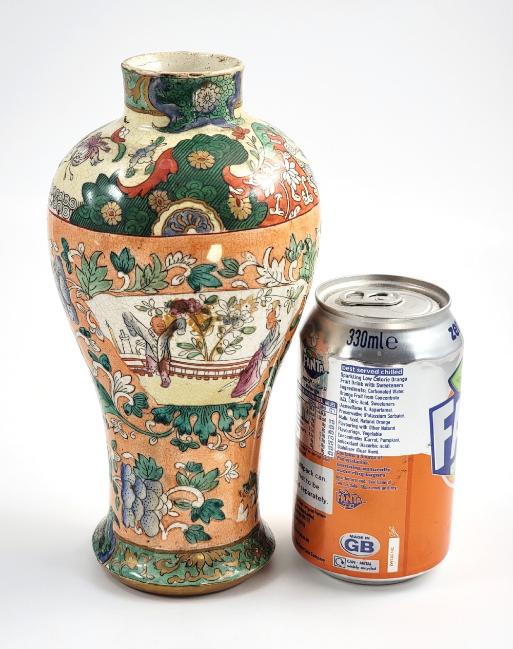 A Regency period baluster-shaped Miles Mason ironstone vase featuring an orange background with intricate hand-painted Chinoiserie floral patterns and polychrome enamel detailing. View IV
