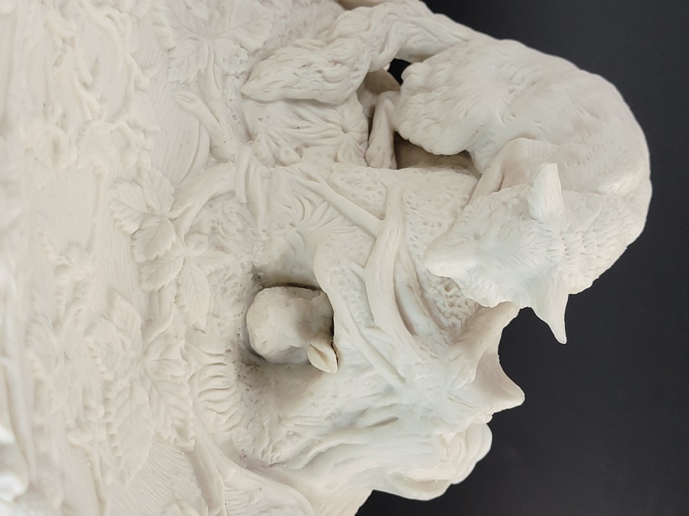 An off-white Parian porcelain centrepiece dish featuring a sculpted fox perched on a central stump above a rabbit in a hollow base surrounded by leaves. View VIII