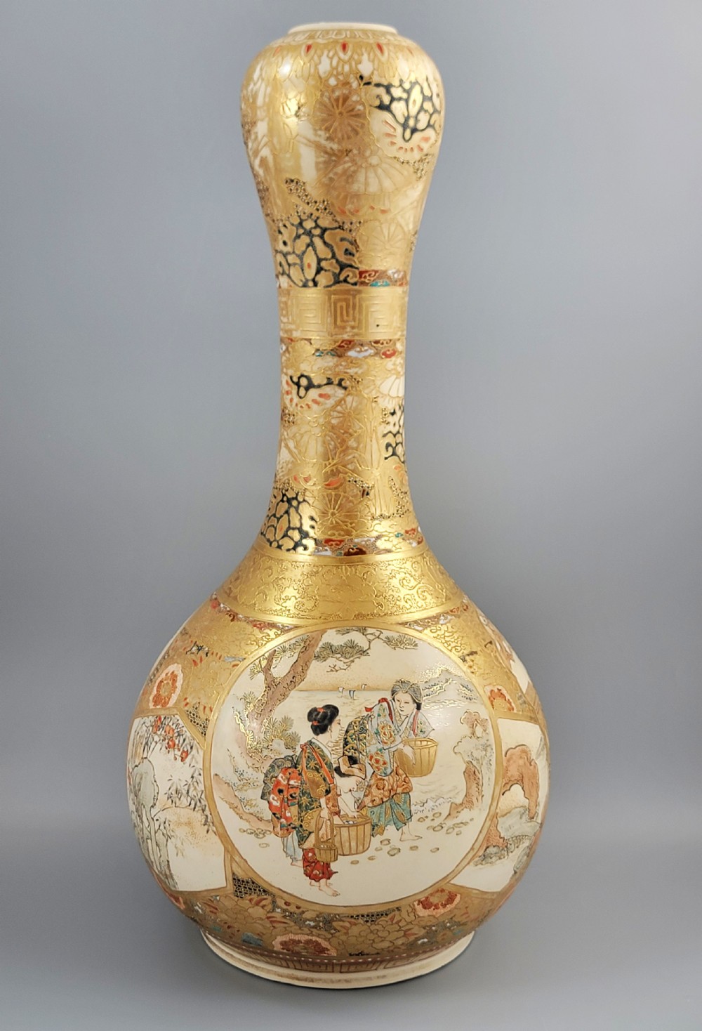 A Japanese Satsuma earthenware vase featuring a bulbous garlic-shaped mouth, intricate gilded borders, and painted panels depicting samurai warriors. View III