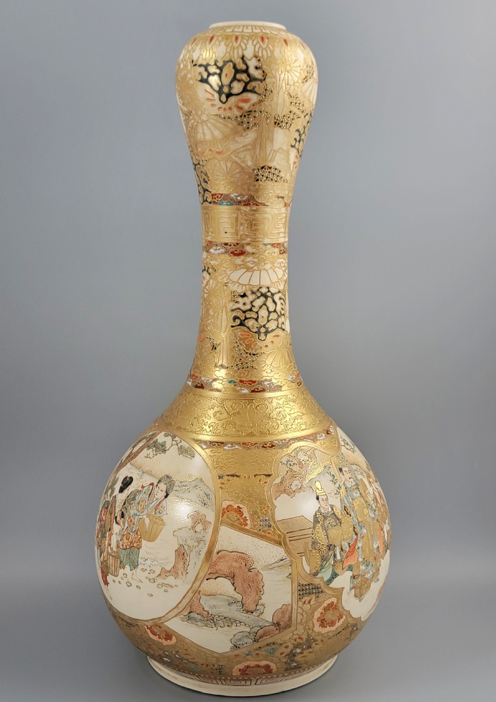 A Japanese Satsuma earthenware vase featuring a bulbous garlic-shaped mouth, intricate gilded borders, and painted panels depicting samurai warriors. View IV