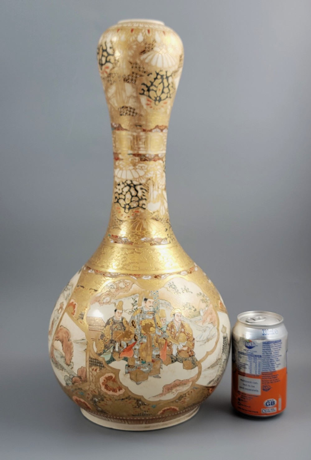 A Japanese Satsuma earthenware vase featuring a bulbous garlic-shaped mouth, intricate gilded borders, and painted panels depicting samurai warriors. View VI