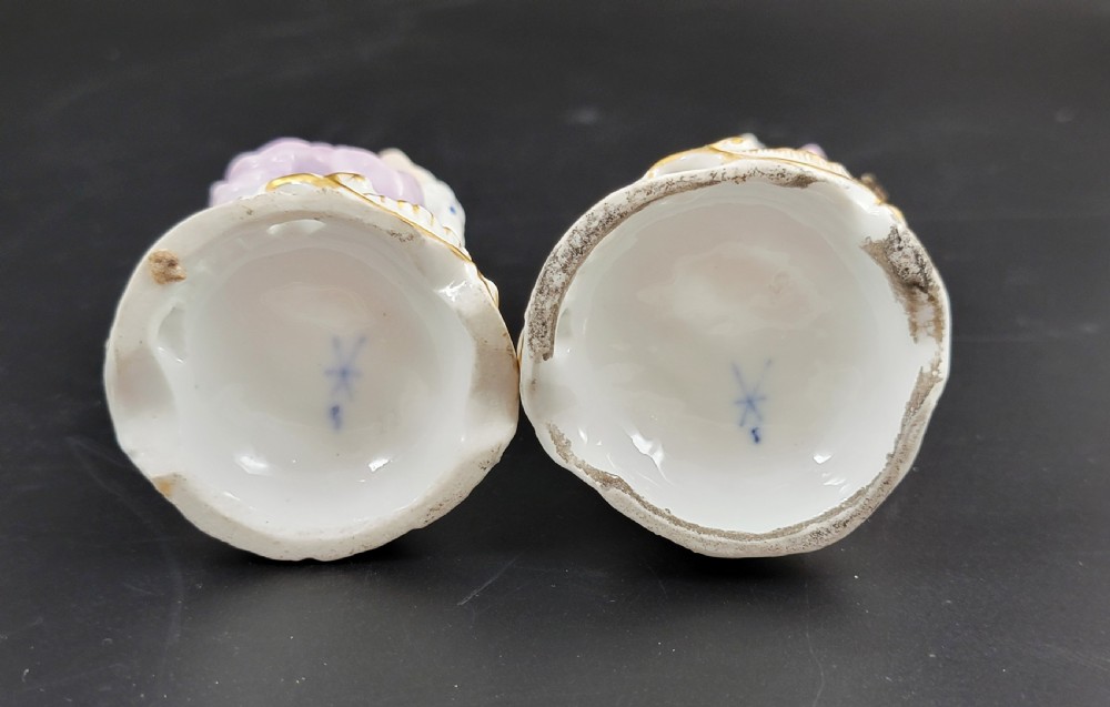 A pair of 19th-century Samson porcelain figures depicting street vendors in hand-painted colourful period dress standing on pierced scroll bases. View VI