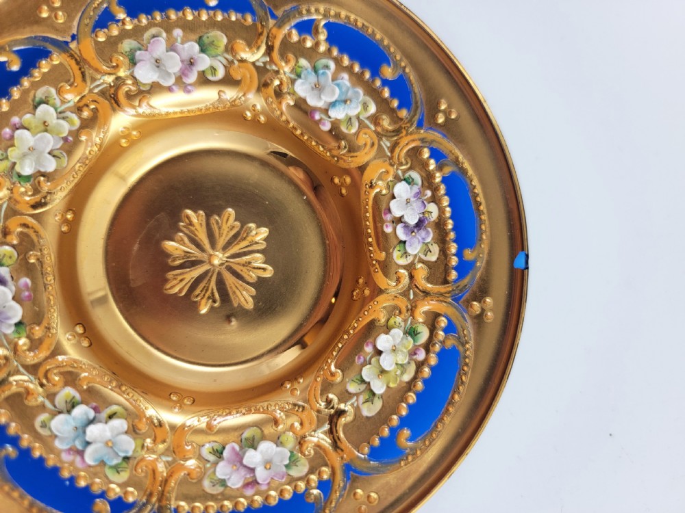 A set of six late nineteenth-century cobalt blue Bohemian glass tea cups and saucers featuring heavy gold gilding and raised enamel floral decoration. View VI