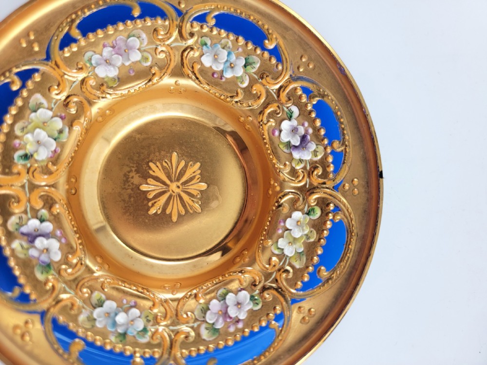 A set of six late nineteenth-century cobalt blue Bohemian glass tea cups and saucers featuring heavy gold gilding and raised enamel floral decoration. View VII