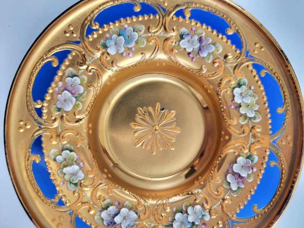 A set of six late nineteenth-century cobalt blue Bohemian glass tea cups and saucers featuring heavy gold gilding and raised enamel floral decoration. View VIII