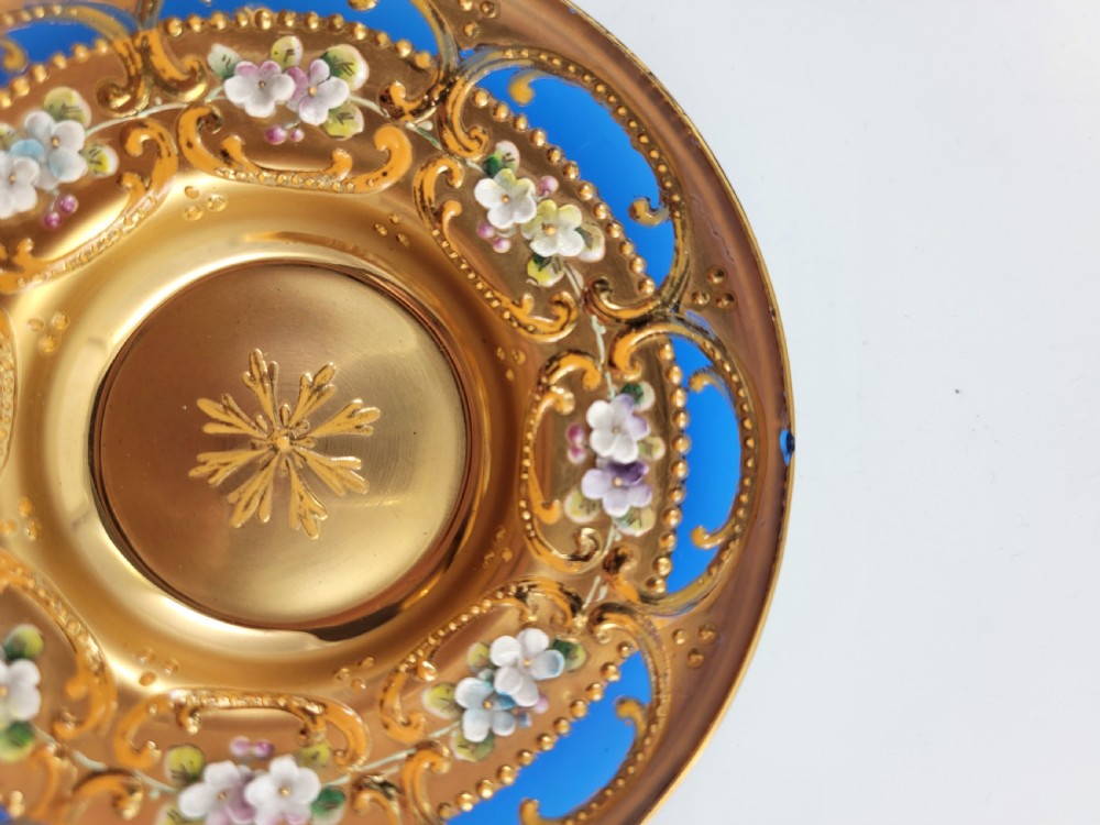 A set of six late nineteenth-century cobalt blue Bohemian glass tea cups and saucers featuring heavy gold gilding and raised enamel floral decoration. View IX